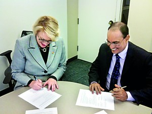 Sheri Noren Everts --Vice President for Academic Affairs and Provost-- Illinois State University signs the Mou With Professor Lalith Gamage, CEO SLI