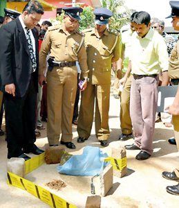 Mannar Magistrate Anthonypillai  Judeson visiting the scene of the crime in Uppukulam, Mannar. Pic by S.R. Lambert