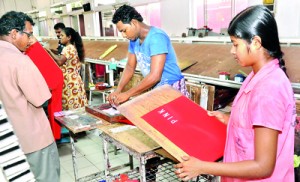 Checking the finished product.Pix by Mangala Weerasekera