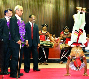 Retired civil servant Bradman Weerakoon looks on in amusement probably  wondering whether the country is also upside down like this dancer. The event was the annual Integrity Awards of Transparency International (TI) on Thursday in which Mr Weerakoon was the chief guest. Pic by Amila Gamage.