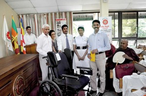 At the 7th Annual General Meeting of the Red Lotus Organisation held recently, ten wheel chairs and crutches donated by Wheel Chairs for Sri Lanka (WC4SL) in Canada were handed over to recipients. In the picture are Guest Speaker, Dr. Pushpa  Ramyani de Zoysa,  President  Deshabandu Olcott Gunasekera, Hony Secretary Dr. Hema Goonatilake, Director Planning, Ministry of Social Services and Hony. Secretary, M. Ramamoorthy and a representative of the Pahalamapitigama Rajamaha Vihara Welfare Society Ajith Nawagamuwa, receiving a wheel chair.