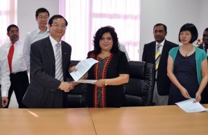 President GCAC   Prof. Wu  Wanmin and Mrs. Sherryn Yaseen CEO immediately after signing of MOU for Airport Operations Management Program. Looking on Mr. Suresh Yaseen Director Operations ACHE, Mr Xu Dean of Business Management, Dr. Sylvia Li Director International Affairs GCAC and Mr. Rohana Nanayakkara Program Manager.