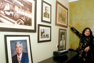 Mrs. Senanayake  points to  a family photo gallery