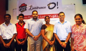 Anushka Ranasinghe (Director HR), Chris Bernet (Manager-Training), and Instructress-Shrimanie Kiran Wanigasekera, flanked by the best performers from the programme.