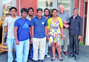Professor Senaratne (right) with his industry partner Mr. John Holdem (second from right) and with GISM students who study the final year of the Degree at Massey University, New Zealand.