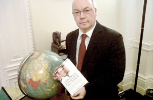 Alistair Burt is seen with the book “Democracy, Sovereignty and Terror: Lakshman Kadirgamar on the Foundations of International Order” at his office in  London recently.