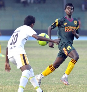Hat-trick hero N.C.M Rahuman (right) races to the ball.  Pic by Susantha Liyanawatte