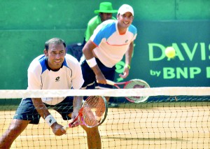 Aisam Qureshi serves up a rocket to his Lankan opponents. Pix by Amila Gamage.