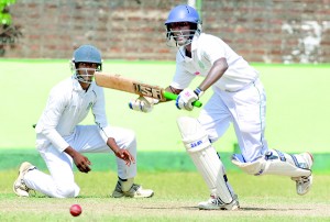 St. Benedict’s batsman Madura Madushan in full swing against St. Sebanstian’s in their first XI cricket match which was played at Moratuwa last week.