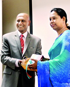 Seen here is Samantha Kumarasinghe, Chairman of Nature's Beauty Creations Ltd making the first presentation to the then, Minister of Technology and Research Pavithra Wanniarachchi.