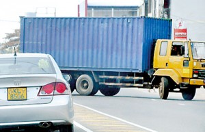 A container blocks the exit of a fuel station