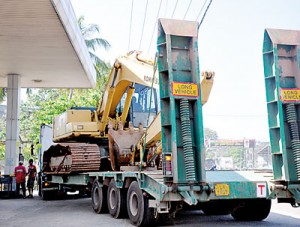 Should heavy laden vehicles  such as this be permitted into fuel stations? Could they not be refuelled prior to being loaded?