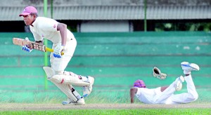 A Richmond batsman demonstrating his fighting qualities against Prince of Wales’ in their first XI match played at Moratuwa. 	 - Pix by Amila Gamage.