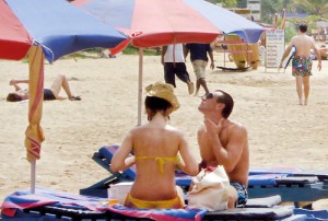 Tourists enjoying the sun and the sand on a beach in the South. Incidents of sexual harassmnt of foreigners have been on the rise. Pic by S. Siriwardhana