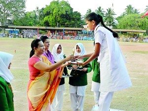 Chief Guest minister Pavithra Wanniarachchi distributing an award.