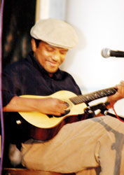 Feizal Samath: Strumming  his guitar for a cause