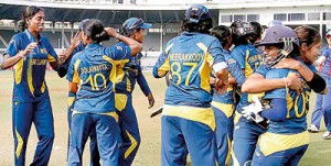 Sri Lankan women cricketers celebrate their win against defending world champions England in the ICC Women's World Cup 2013 played in Mumbai