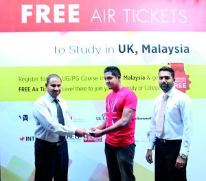 From Left Chairman of BCAS Mr. Abdul Rahman handing over the free Air to the Student along with Regional Manager Azaad Abdulla.