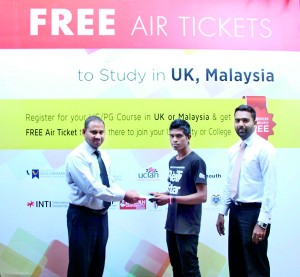 From Left Chairman of BCAS Mr. Abdul Rahman handing over the free Air to the Student along with Regional Manager Azaad Abdulla.