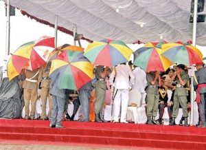 Rain proved a spoiler; VIPs in the front rows were seen tucking up their trousers  and running for shelter