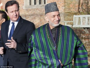 Corruption concern: Afghan civil servants and officials pocketed �2.5bn in bribes last year despite promises by President Hamid Karzai (pictured with David Cameron) to clean up his government