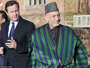 Corruption concern: Afghan civil servants and officials pocketed 2.5bn in bribes last year despite promises by President Hamid Karzai (pictured with David Cameron) to clean up his government