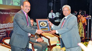 CA Sri Lanka President Mr. Sujeewa Rajapakse being presented with a token of appreciation