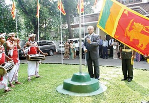 Ambassador Major General (Retd) Nanda Mallawaarachchi hoisting the national flag