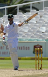 Robin Peterson raises his bat after scoring a half century during day 3 of the second test between South Africa and Pakistan at Newlands in Cape Town on February 16, 2013. AFP