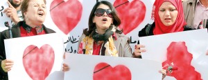 Iraqis women take part in Valentine's Day rally in Baghdad's Tahrir Square calling for better public services and for a corruption-free on February 14, 2013.  A organizer said they were calling on their leaders to love the war-battered country rather than rob its resources. AFP/Ahmad al-Rubaye