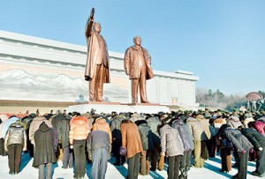 North Koreans bow in front of statues of North Korea founder Kim Il-sung (L) and late leader Kim Jong-il at Mansudae in Pyongyang on the birthday of their late leader, Kim Jong-il. Reuters