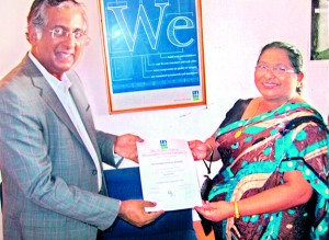 Mr. Nandakumar Shamanna, Zonal Chair of DNV BA South India & Sri Lanka, presents the ISO Certificate to Chairperson, Mrs Nirmalie Saparamadu of OKI International School, Wattala on 8th January 2013