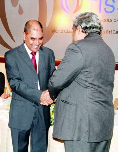 Dr Harsha Alles  handing over the first plaque to Founder President, Dr. Frank Jayasinghe