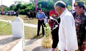 Indian High Commissioner Ashok Kantha who visited Jaffna yesterday laying a wreath at the IPKF memorial as Sri Lanka called off a mid-sea protest against Indian poaching. Pic by N. Parameshwaran
