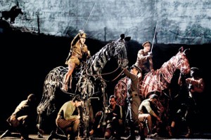 A scene from War Horse: Sanjit (second from left kneeling) is the foreleg puppeteer. Pic by Paul Kolnik