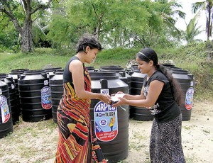 Ayesha Perera presenting a water tank