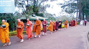 The monks on pindapatha and right, Ajahn Brahmali accepts alms
