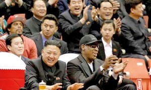 New pals: North Korean leader Kim Jong Un, left, and former NBA star Dennis Rodman laugh and cheer at they watch North Korean and U.S. players during a game in Pyongyang
