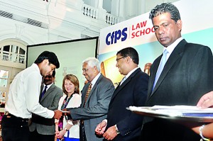 Mr.A.S.M. Perera Awarding the Scholarship for one of the  Scholarship winners.