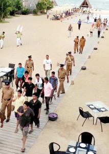 The scene of last Sunday's incident at a five-star hotel in Passikudah. Policemen taking the son of Health Minister Maithripala Sirisena and his freinds to the police station after they assaulted the son of Eastern Province DIG Ravi Waidyalankara. The Health Minister has described the incident as a minor one. The DIG's son is recovering at a Colombo private hospital.