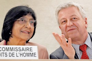 U.N. High Commissioner for Human Rights Navi Pillay listens to Remigiusz Henczel, President of the Human Rights Council before delivering her annual report to the 22nd session of the Human Rights Council at the United Nations in Geneva REUTERS