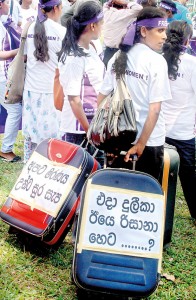 The focus of International Women’s Day activities in Sri Lanka was on the plight of nearly one million women going through severe hardship in West Asian countries. The Freedom for Women Movement and other groups staged a protest march from Hyde Park to Green Path, Colombo, carrying housemaid’s travelling bags with the cry “Duleeka then, Rizana yesterday and who’s next”.  Pic by M.D. Nissanka