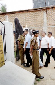 Some of the suspects are seen walking into the Valaichchenai Magistrate Court. Pic by Deva Adiran