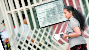 Soon in for a rude shock: A Consumer heads to the electricity payment centre at CEB headquarters in Colombo.  Pic by Mangala Weerasekera