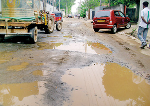 Roads are left in a  state of disrepair as construction work continues