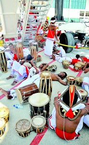 Dead beat: Traditional drummers  find a cool spot away from the heat