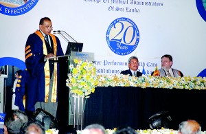 Surgeon Rear Admiral N.E.L.W. Jayasekera delivering the presidential address at the 20th annual scientific sessions of the College of Medical Administrators of Sri Lanka. At the head table are Defence Secretary Gotabaya Rajapaksa and Dr. Roger Boyd, Chair of the World Federation of Medical Managers