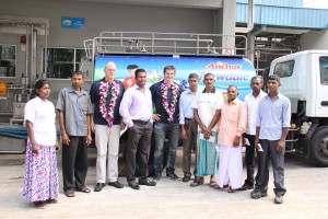 Seen here Richie McCaw (centre) with farmers and officials