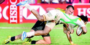 Sri Lanka replacement fullback Mohamed Sheriff is brought down by a Kazakhstan defender. - Pix by Amila Gamage