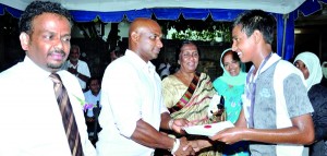 The Man Of The Match in the Inter House Cricket Match ‘ Abdul Samad ’ proudly receiving  the prize from the Chief Guest